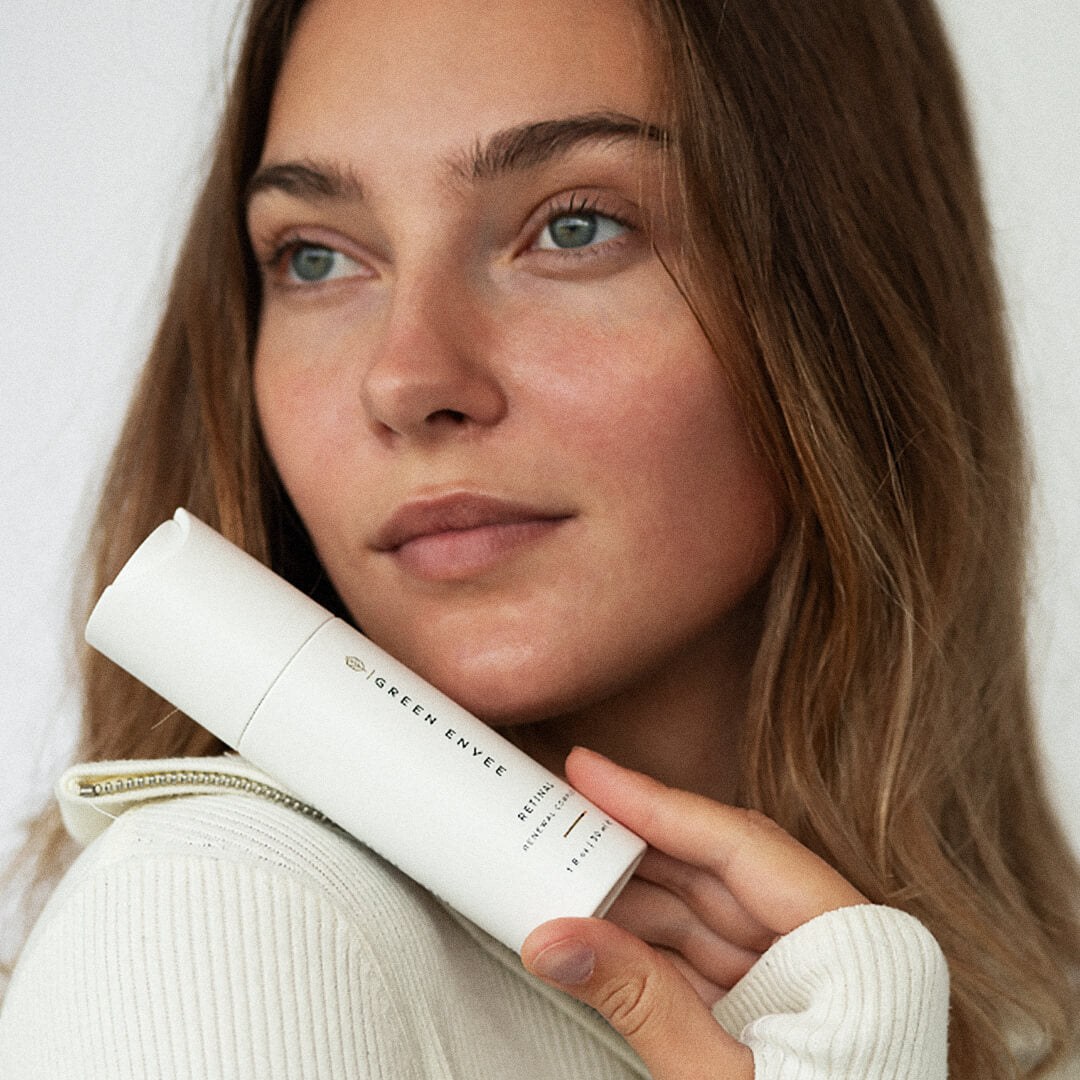 Green Envee Retinal Renewal Complex held in hand